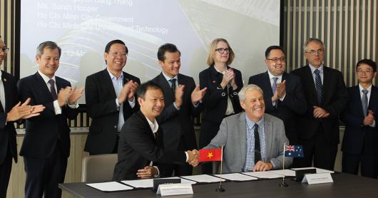 A group of dignitaries signing the UTS Ho Chi Min University of Technology research agreement