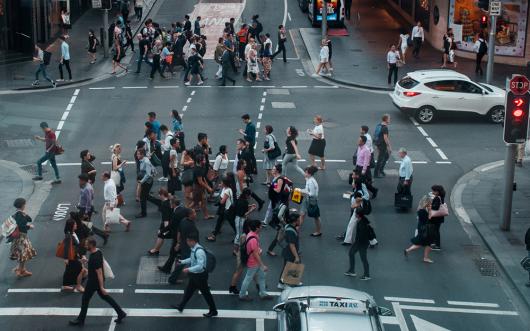 Stock picture of a group of people crossing a street in central sydney