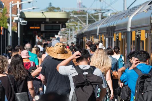 crowd waiting for a train. Adobe Stock