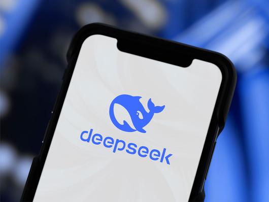 Stock picture of a phone displaying the DeepSeek name and logo