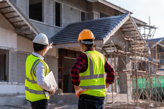 supervisors at a house construction site