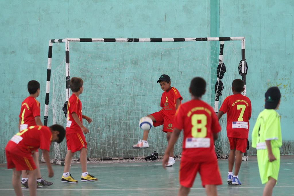 A group of young boys playing football