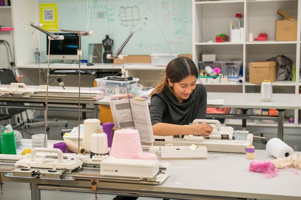 DAB Kinitting Lab, student threading cotton 