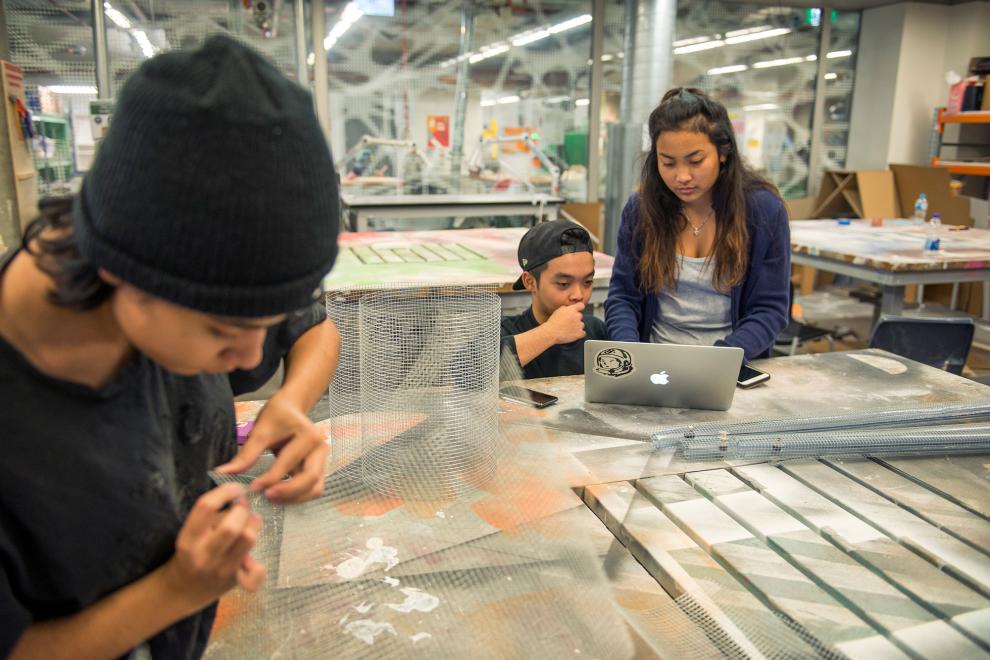 Student moulding a metal material into the desired shape. 
