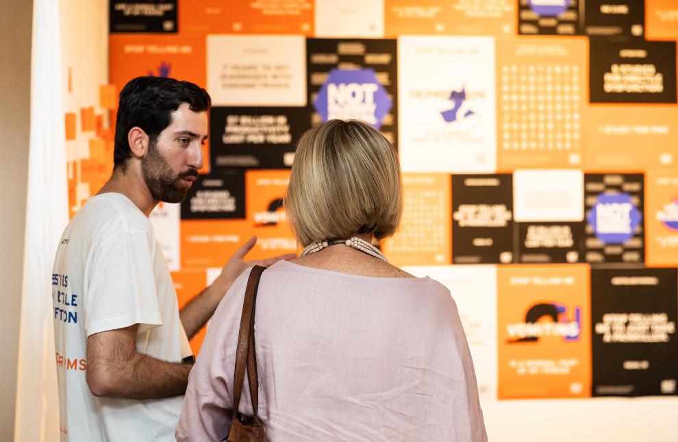 Two people talking at BCii market day 2019