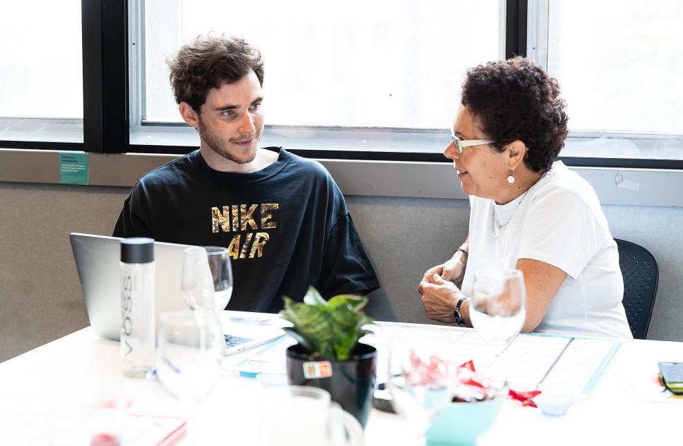 TD staff member talking to a student at BCii market day 2019
