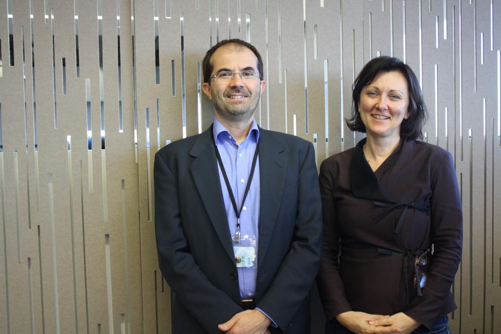 one male and one female academic with a light coloured screen