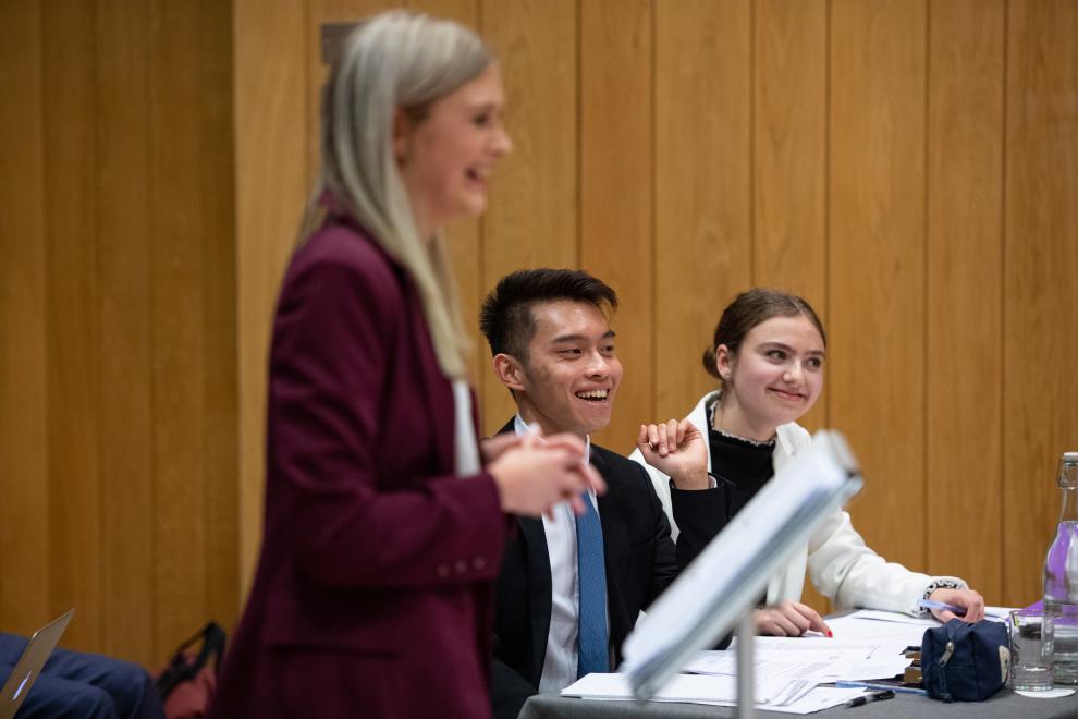 smiling woman presents to court