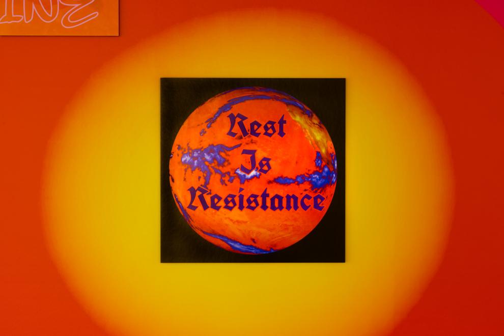 A poster that reads 'Rest is Resistance' 