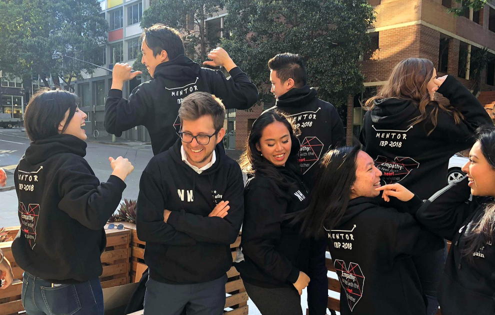 A group of 2019 mentors displaying their cohort's hordie