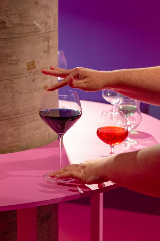A close up photo of a person's hands playing the glass harp