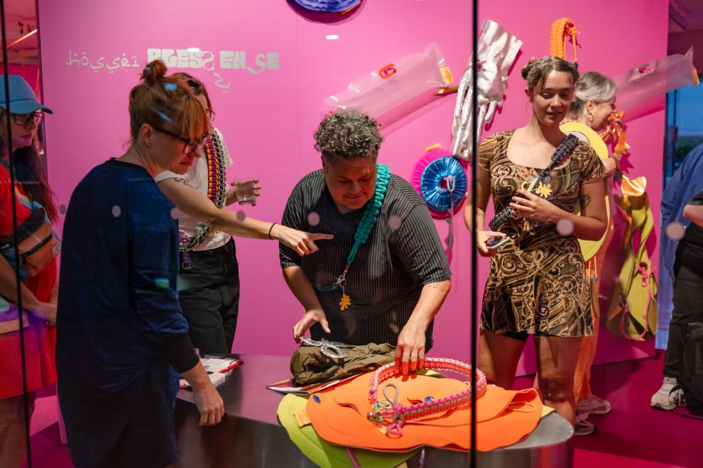 People in a shopfront choosing accessories
