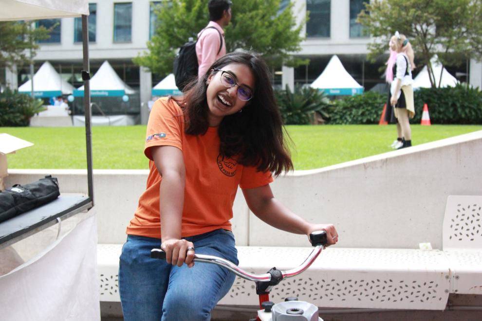 A Peer Networker on a bike, laughing