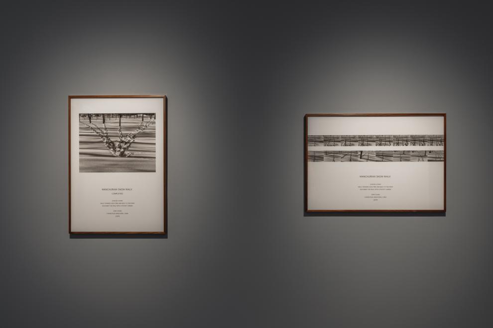 Two framed black and white photographs of footprints in the snow