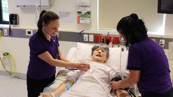 Students in a critical care simulation