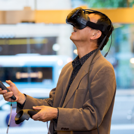 man using VR technology built by a UTS student, being displayed at the Student Showcase 