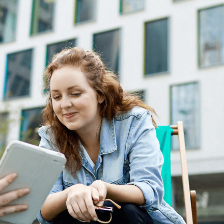 Students using tablets on the UTS Alumni Green