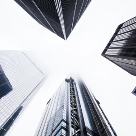 Looking up to tall city buildings