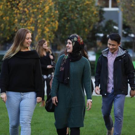 three students walking together