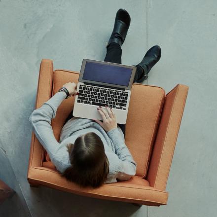 A woman studying on a laptop