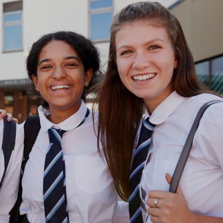 Two female students smiling