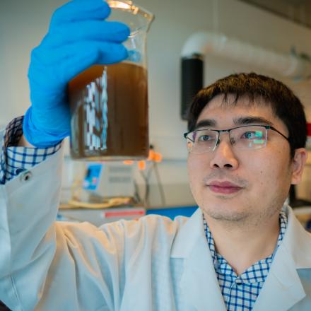 Qilin in a laboratory setting, hold a jar of liquid