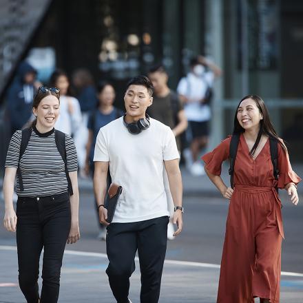 Students walking together outside UTS building eleven