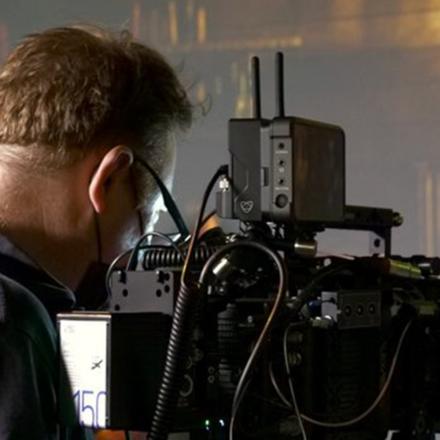 Videographer on virtual set