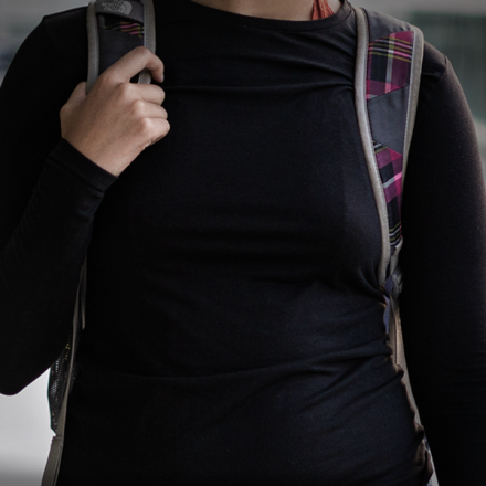 Student holding a backpack