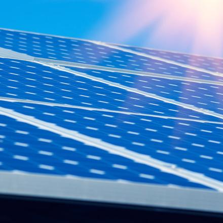 An array of solar panels, looking towards the sun