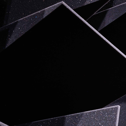 Close up of the wall of an anechoic chamber. Colours are black and grey
