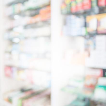 Pharmacy blurred background with medicine on shelves