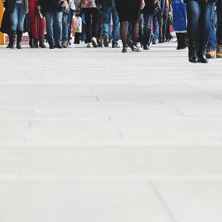 Crowd of people walking on street