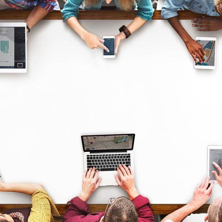 Group of people working on laptop, mobile and tablet
