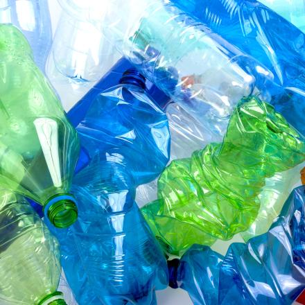 A close-up of green and blue plastic bottles