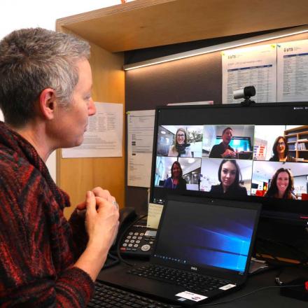 lecturer speaks with prospective students over video call