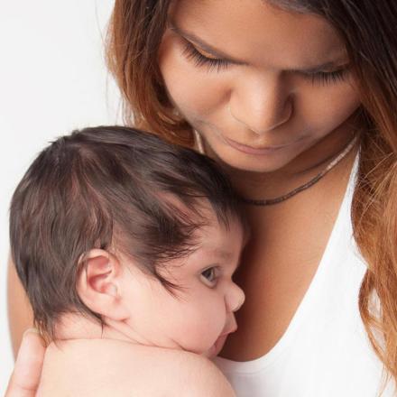 Mother holding her baby