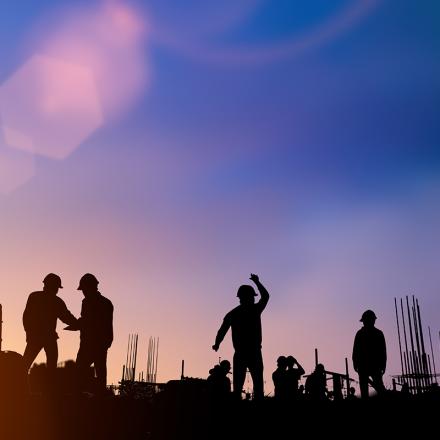 Silhouette of engineer and construction team working at a site