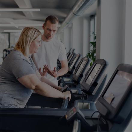 Woman on a treadmill at a gym