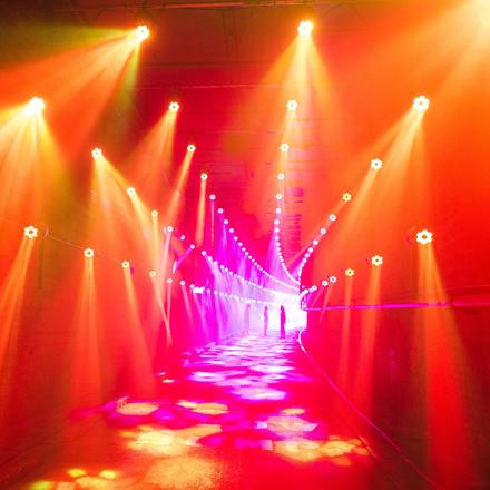 Tunnel illuminated with orange and pink lights