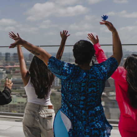 Women with their hands up in the air