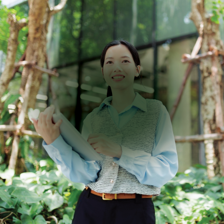 Woman standing in green space 