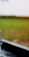 Image of water flowing from pipe into an irrigation channel