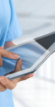 Female nurse holding an iPad