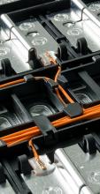 Electric car lithium battery pack with orange wiring connections between cells