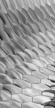 Greyscale geometric hexagonal pattern curving into the distance