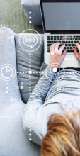 Cropped image of man sitting in chair with laptop