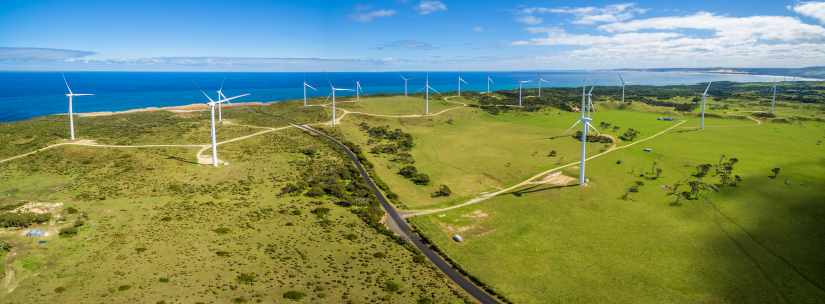 Aerial panorama of rural road and wind farm in Australia