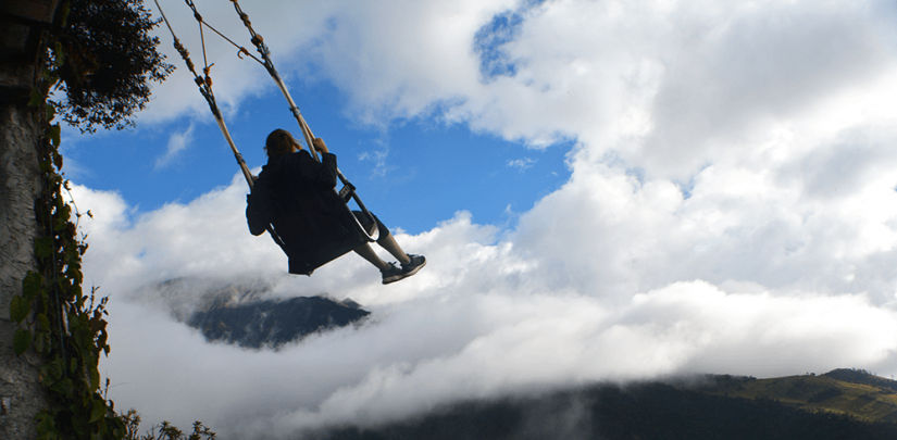 FASS Colombia ICS study tour girl swinging from a tree swing over a valley