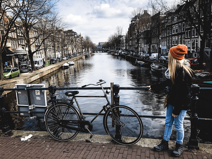 FASS Switzerland ICS study tour girl with bicycle in Amsterdam